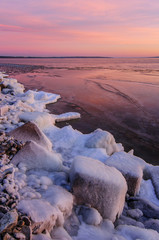winter landscape in the sunset with ice in the sea.