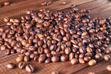 Fototapeta premium Aroma coffee beans on the wooden background