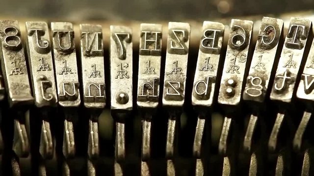 Typing with old typewriting machine, vintage device