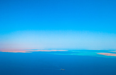 Fototapeta premium boat or ship transporting on ocean sea 