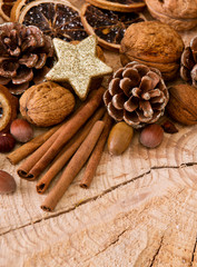 Christmas decoration with different nuts and cinnamon sticks.