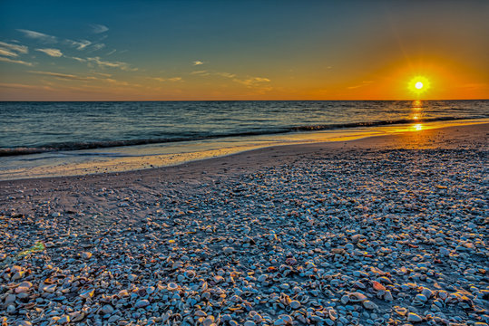 A sunset into the Gulf of Mexico from the beach on Sanibel Island, Florida.
