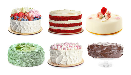 Set of different delicious cakes on white background