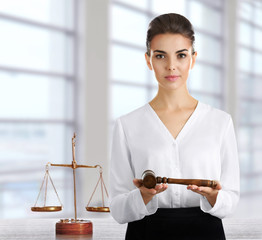 Woman with judge gavel at office. Law and justice concept.