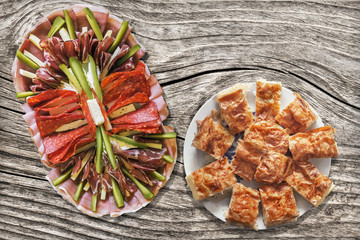Appetizer Dish Meze With Serbian Gibanica Cheese Pie Slices Set On Old Knotted Cracked Wooden Garden Table
