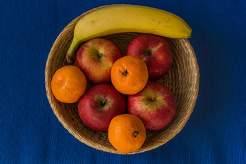 Wooden basket filled with healthy and fresh fruits
