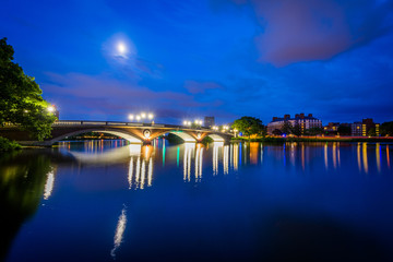 The moon over the John W Weeks Bridge and Charles River at night