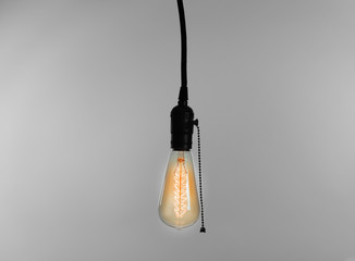 Light bulb on light background