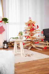 Creative Christmas tree in living room interior