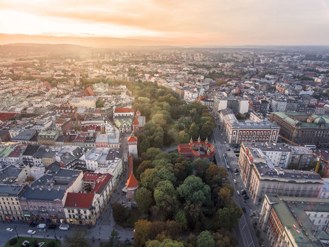 District of Krakow with churches and parks, Poland, aerial view at sunset time