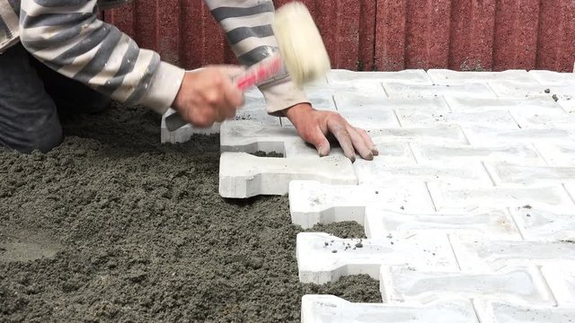 construction worker aranging pavement 4K