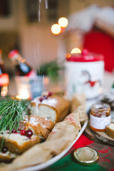 Obraz na płótnie Canvas Festive dinner cake with jam on christmas decorated table