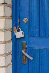Blue old door with three locks