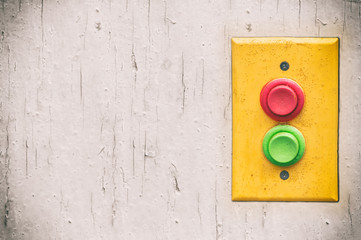 Yellow panel with rempty red and green buttons over bright background