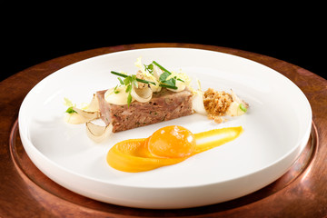 Haute cuisine appetizer with beef and egg