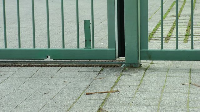 close-up of a closing modern sliding gate