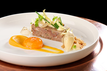 Haute cuisine appetizer with beef and egg