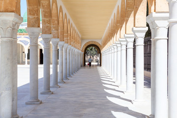 MONASTIR, TUNISIA, AFRICA-CIRCA MAY, 2012: Inner yard of the Tunisian President Habib Bourguiba museum in Monastir, Tunisia, Africa. Long arches corridor