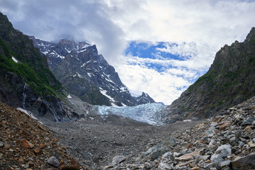 Fototapeta na wymiar Creeping glacier high in the mountains