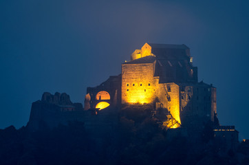 Obraz premium The Sacra di San Michele monastery in the cold winter mist
