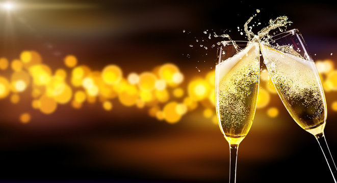 Two glasses of champagne over blur spots background