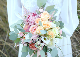 bouquet in hands of the bride