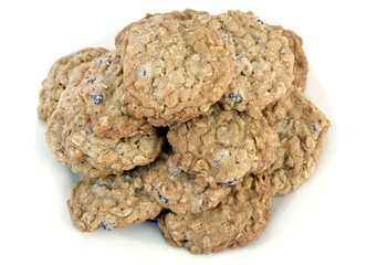 Stack of homemade oatmeal raisin cookies on a white background. Horizontal.