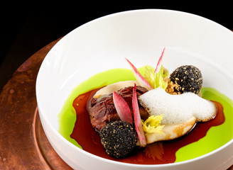 Haute cuisine, grilled Lamb steaks with a sauce of port, and potato balls