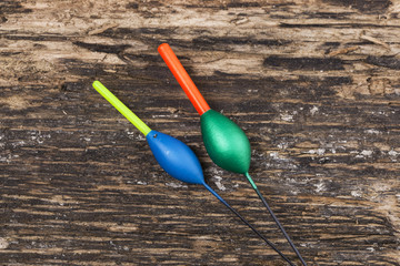 Fishing floats on wooden background © Elena Milevska