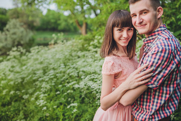 Fototapeta premium young couple in love together on nature in summer