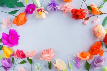 Photo sur Plexiglas Fleurs Colourful handmade paper flowers on light blue background with copyspace in the center