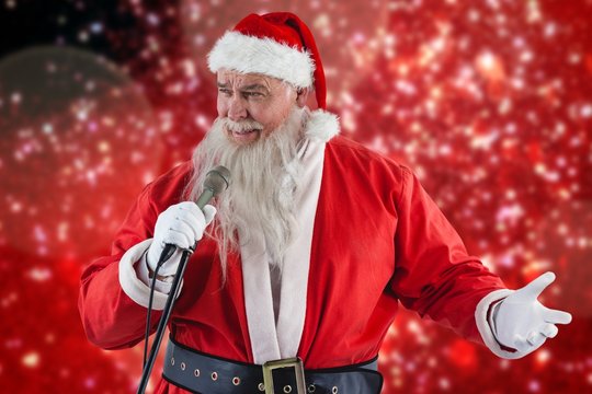 Composite image of santa claus singing song
