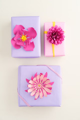 Nicely wrapped presents decorated with handmade paper flowers