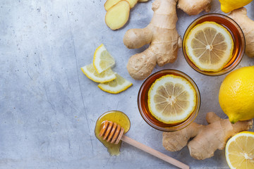Fototapeta na wymiar Ginger tea in a glass for flu cold winter days
