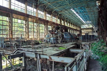 Abandoned, destroyed by war and overgrown machinery of Tkvarcheli power plant 