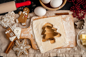 cooking christmas gingerbread on wooden background top view