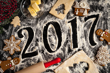 cooking christmas gingerbread on wooden background top view