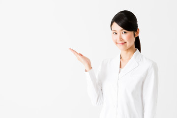 portrait of young asian doctor showing isolated on white background