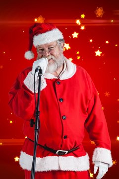 Composite image of santa claus singing songs against white backg