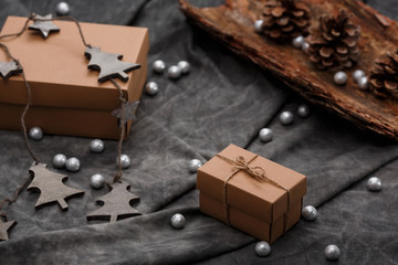 Christmas decoration and gift boxes over grey background.