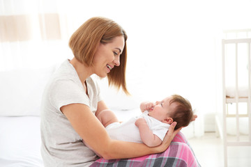 Obraz na płótnie Canvas Mother with baby at home