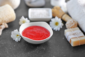 Body scrub and spa treatments on grey table