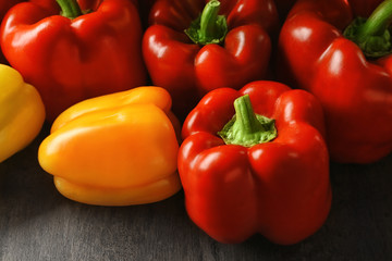 Set of sweet red and yellow peppers on grey table, closeup