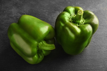 Sweet green peppers on black background