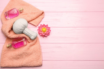 Spa still life with flower on pink wooden background