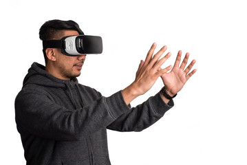 oung asian man wearing virtual reality goggles holding virtual o