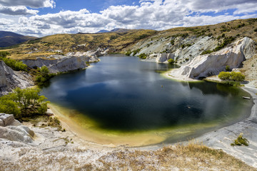 Man-made lake surrounded by limestone, St Bathans, New Zealand