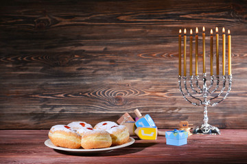 Beautiful composition for Hanukkah on wooden table