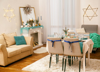 Interior of beautiful living room decorated for Hanukkah