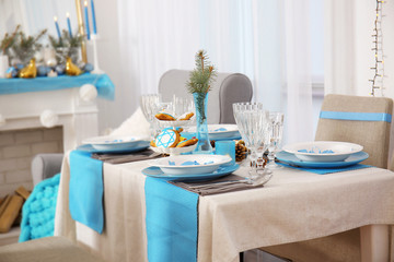 Table served for Hanukkah in living room